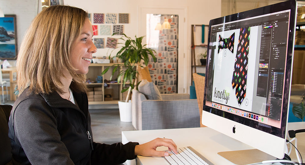 designer working on computer creating tie designs