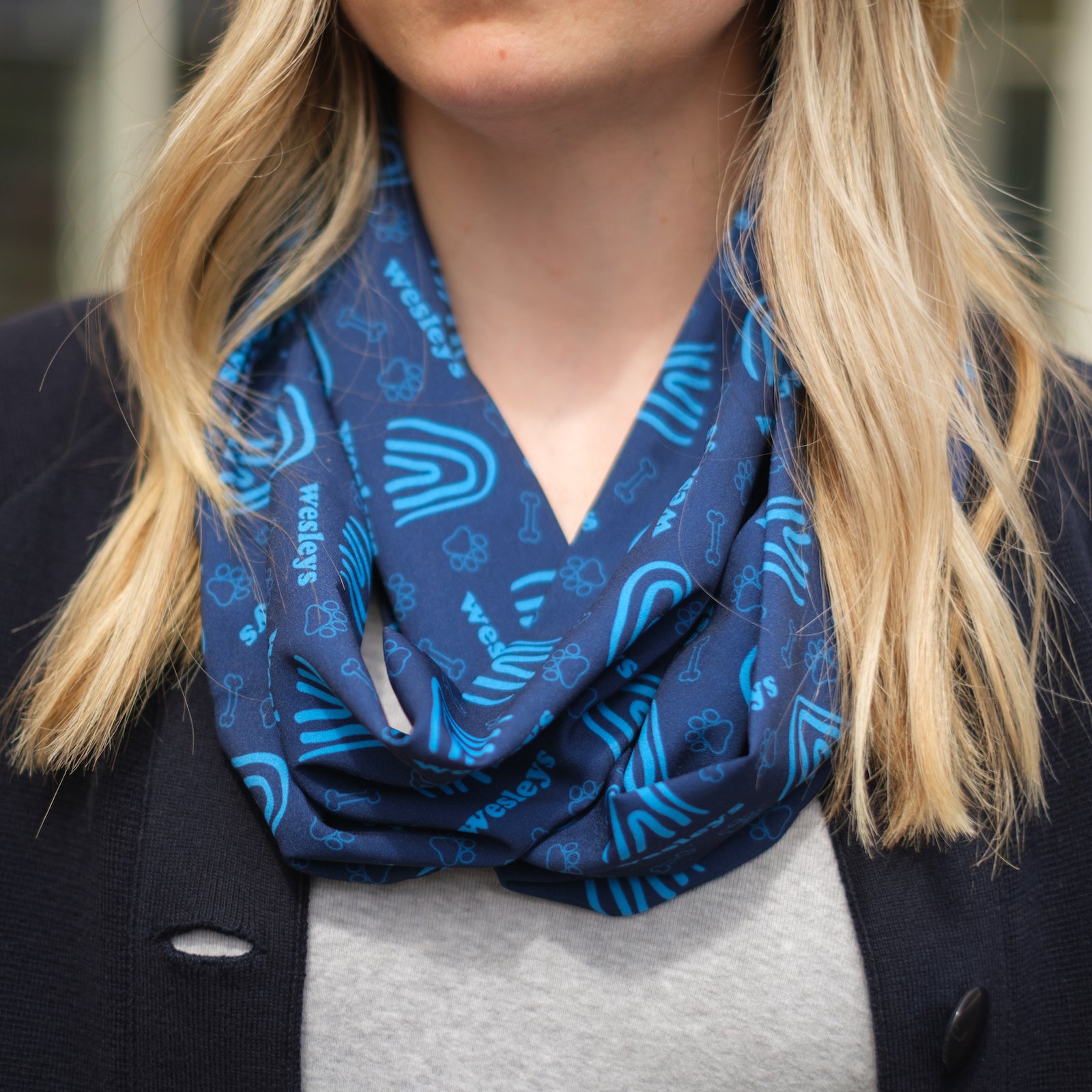 woman wearing blue infinity scarf with custom logo