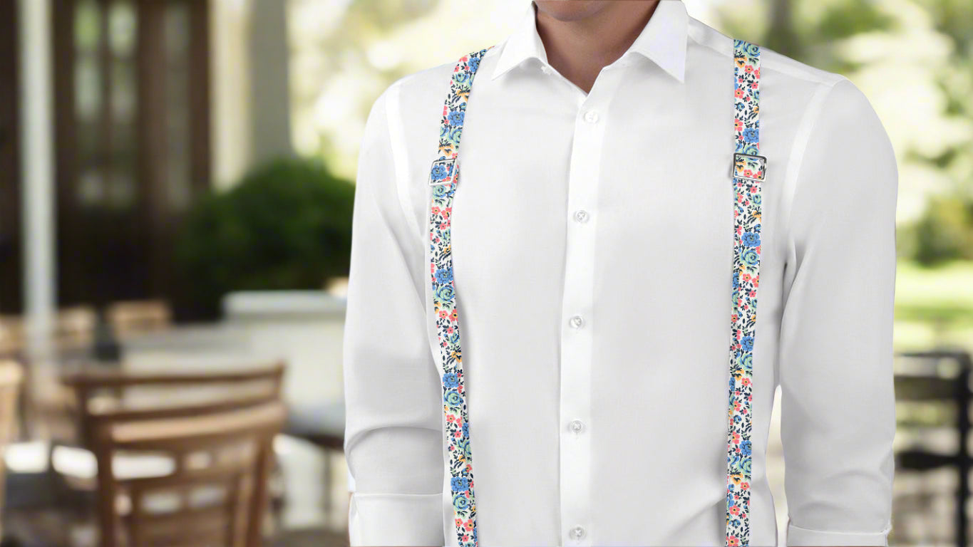 Man wearing floral suspenders and white button down shirt