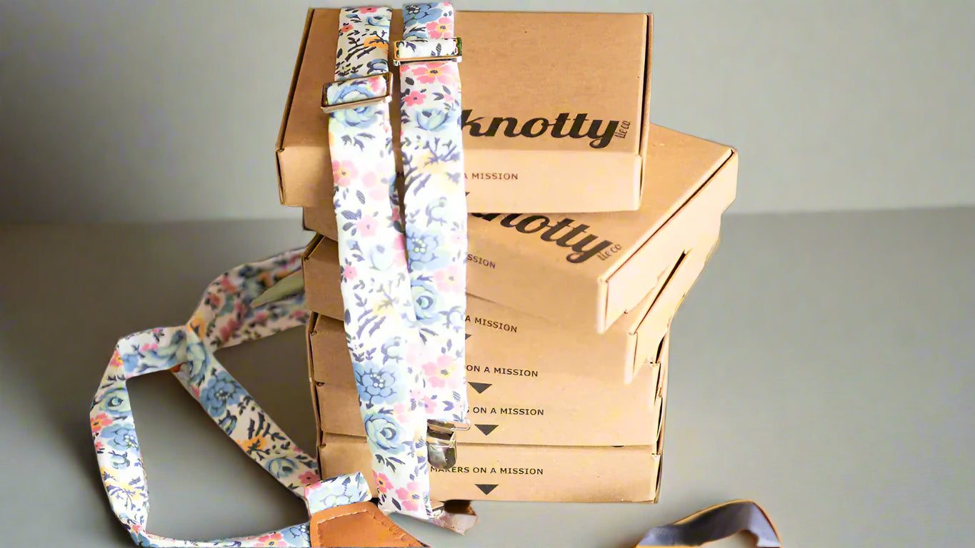 floral suspenders draped over boxes