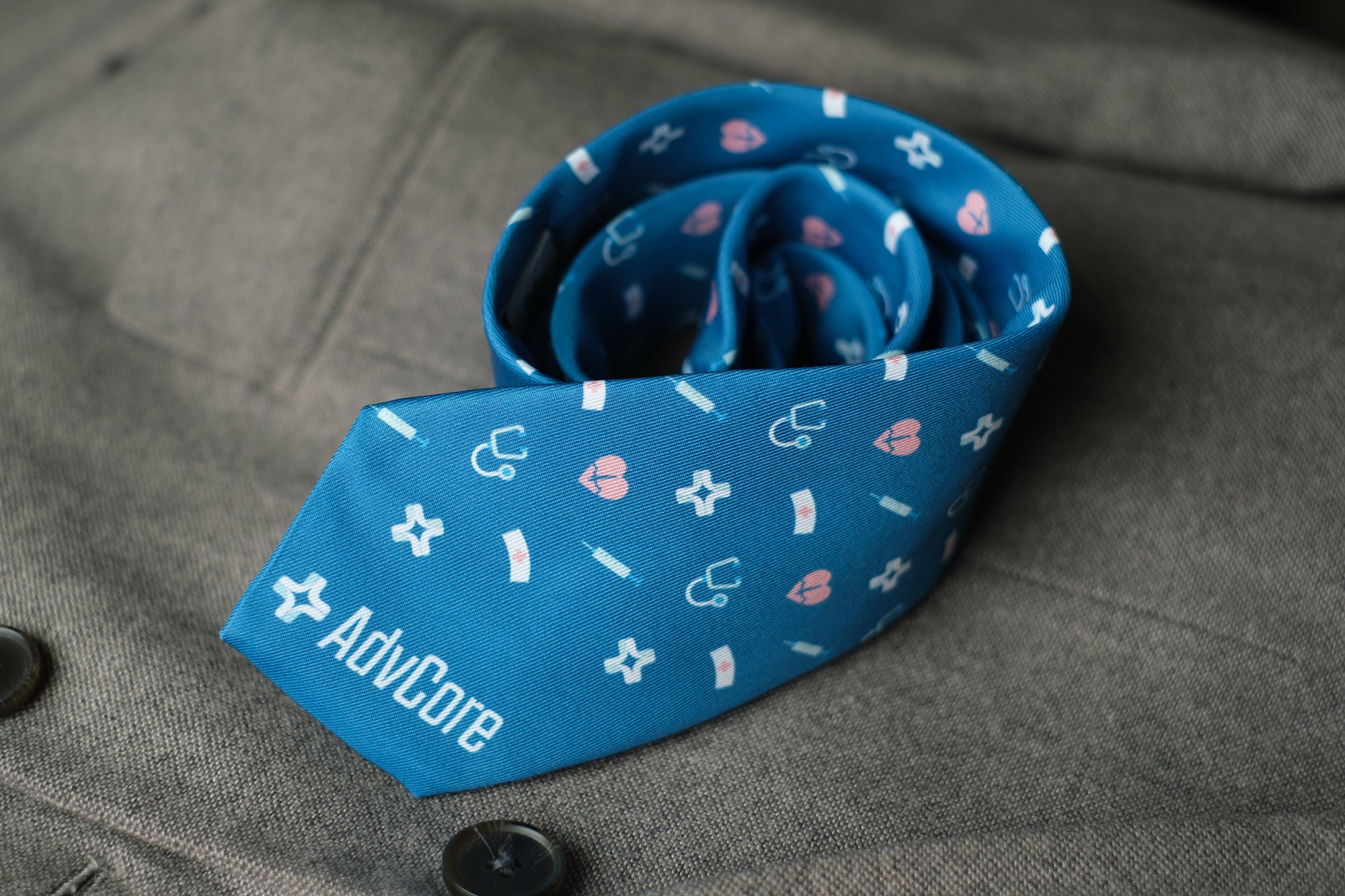 Rolled necktie with custom healthcare design