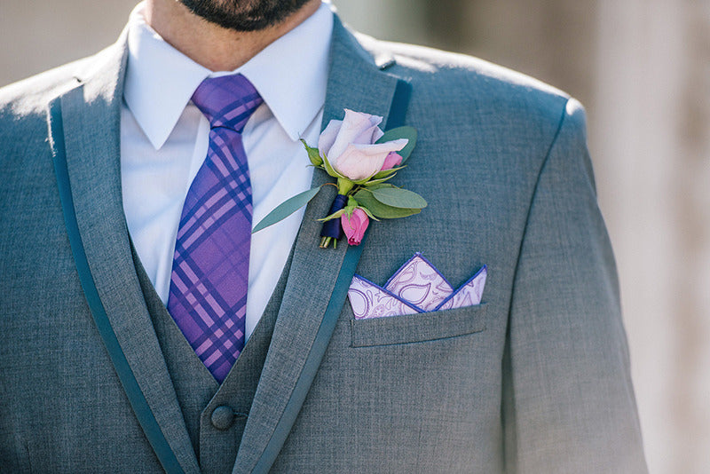 man wearing customized purple wedding necktie and coordinating pocket square